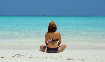 woman sitting on the beach